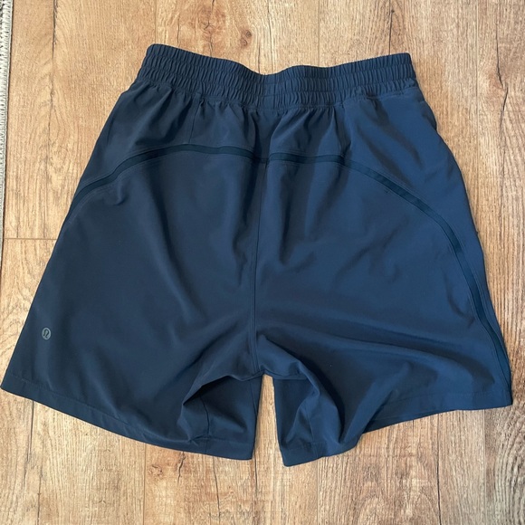 Lululemon Pacebreaker Shorts
7inch inseam
Linerless 
Worn once
Color- Navy - Picture 2 of 3